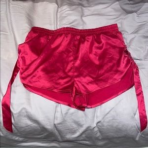 Hot pink satin shorts with buckle details
